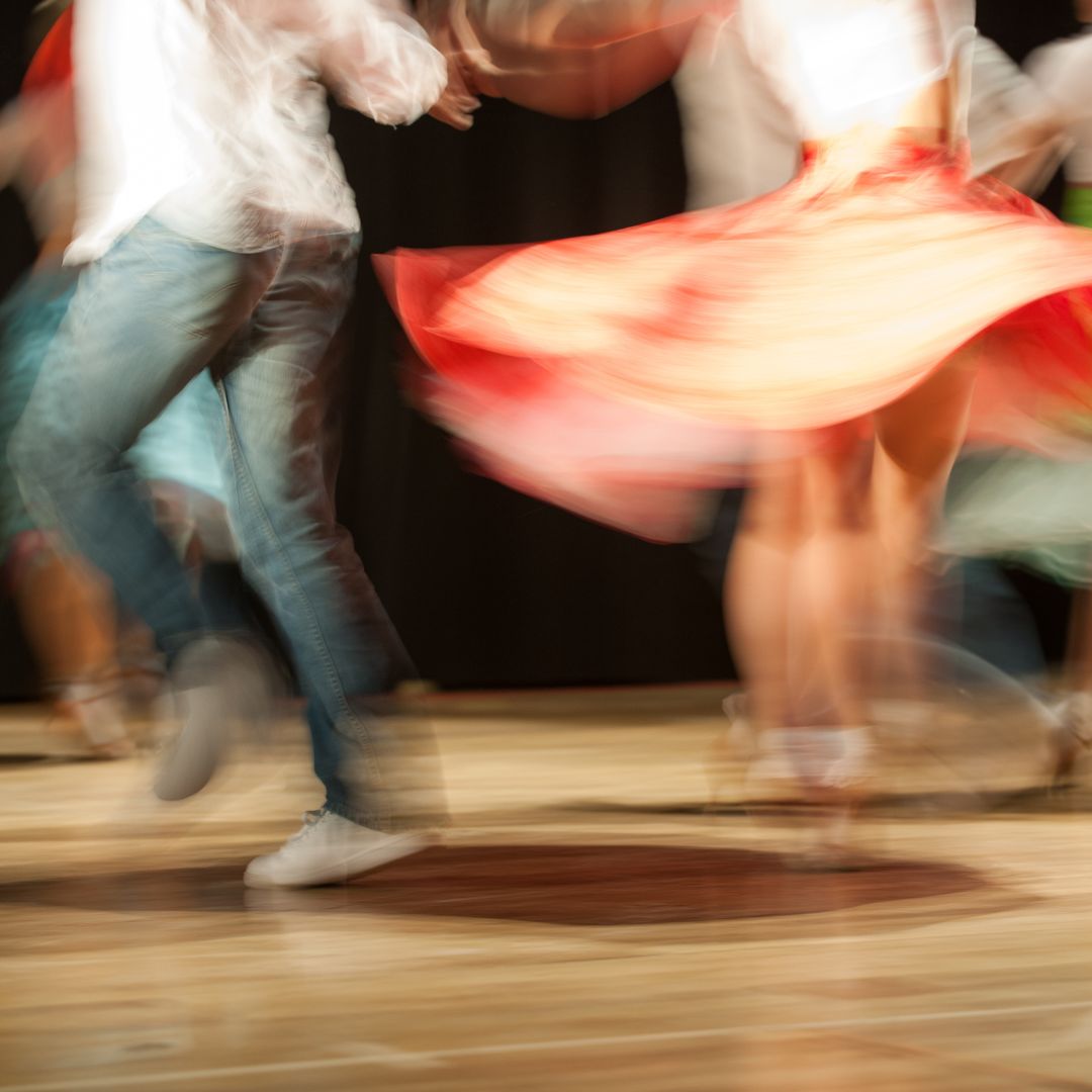 Image shows dancers in motion from the waist down