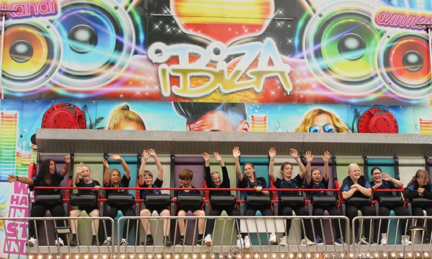Image shows pupils on the magic carpet fair ground ride.