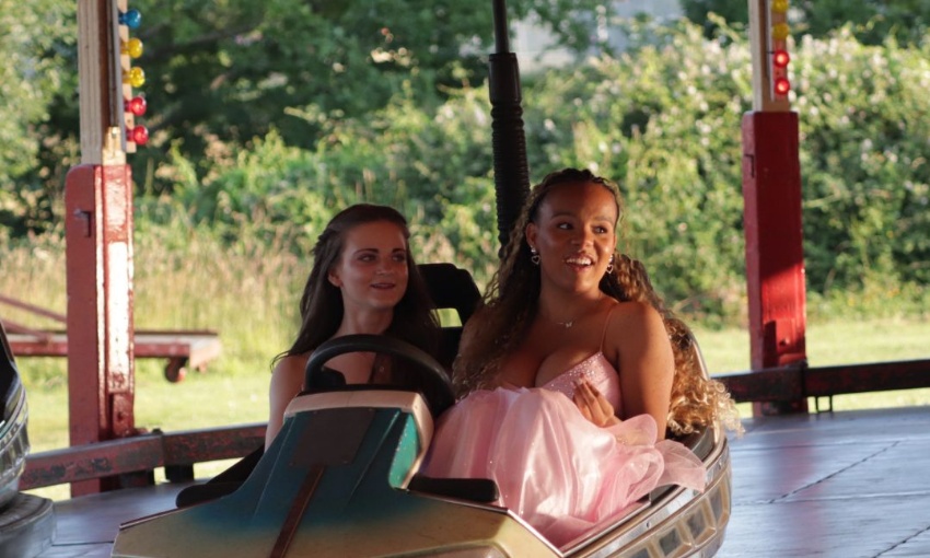 Image shows 2 Y11 pupils enjoying the dodgems during the 2024 Year 11 prom