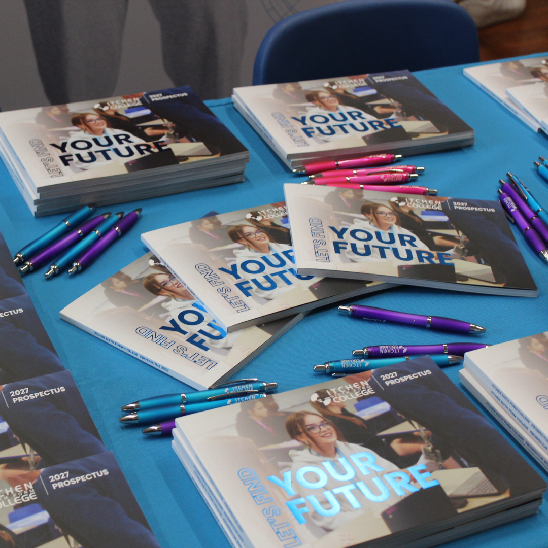 Copies of the Itchen Sixth Form College prospectus for 2027 laid out on a blue table alongside promotional pens.