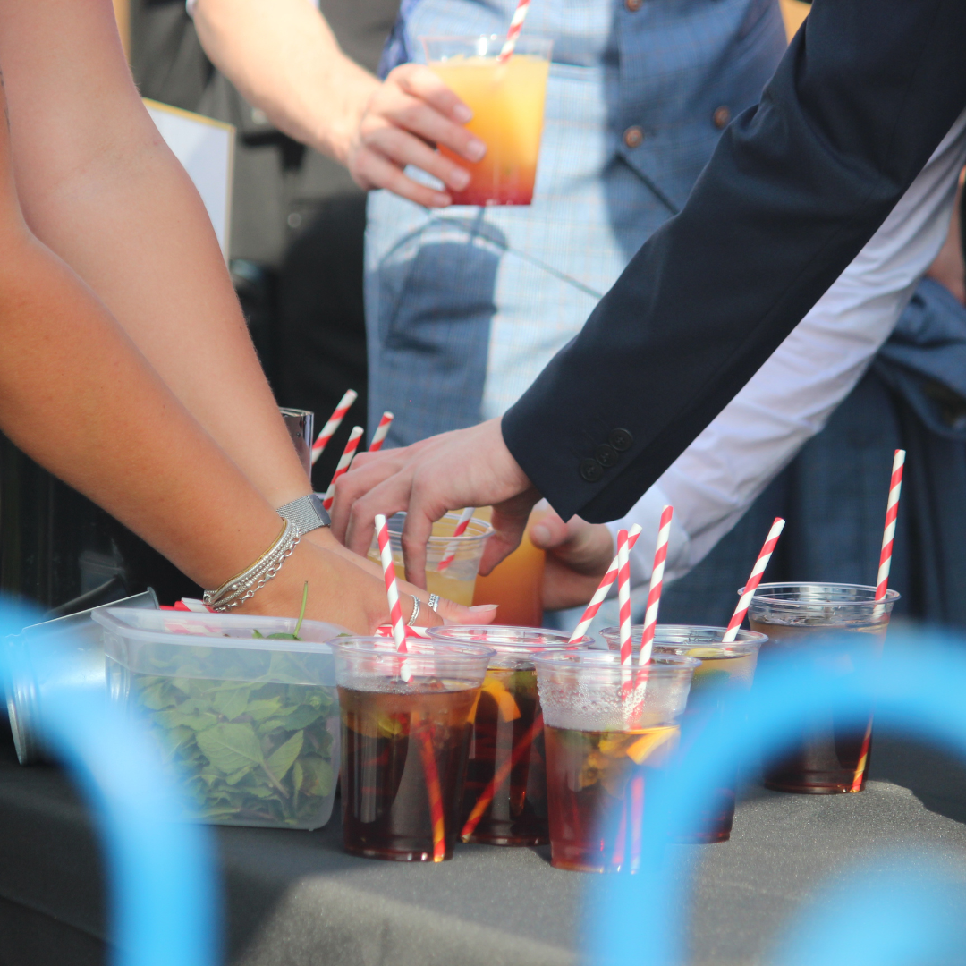 Pupils collecting drinks from a refreshment table.
