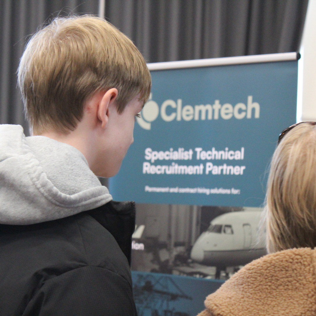 A pupil looking at a display stand for Clemtech Specialist Technical Recruitment Partner during a careers event.