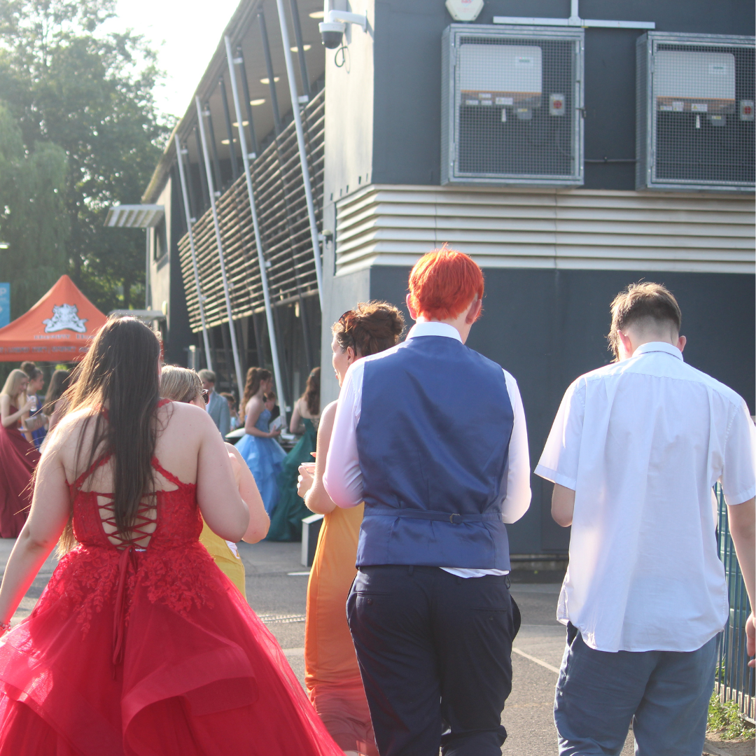 Group of pupils walking together outside the prom venue.