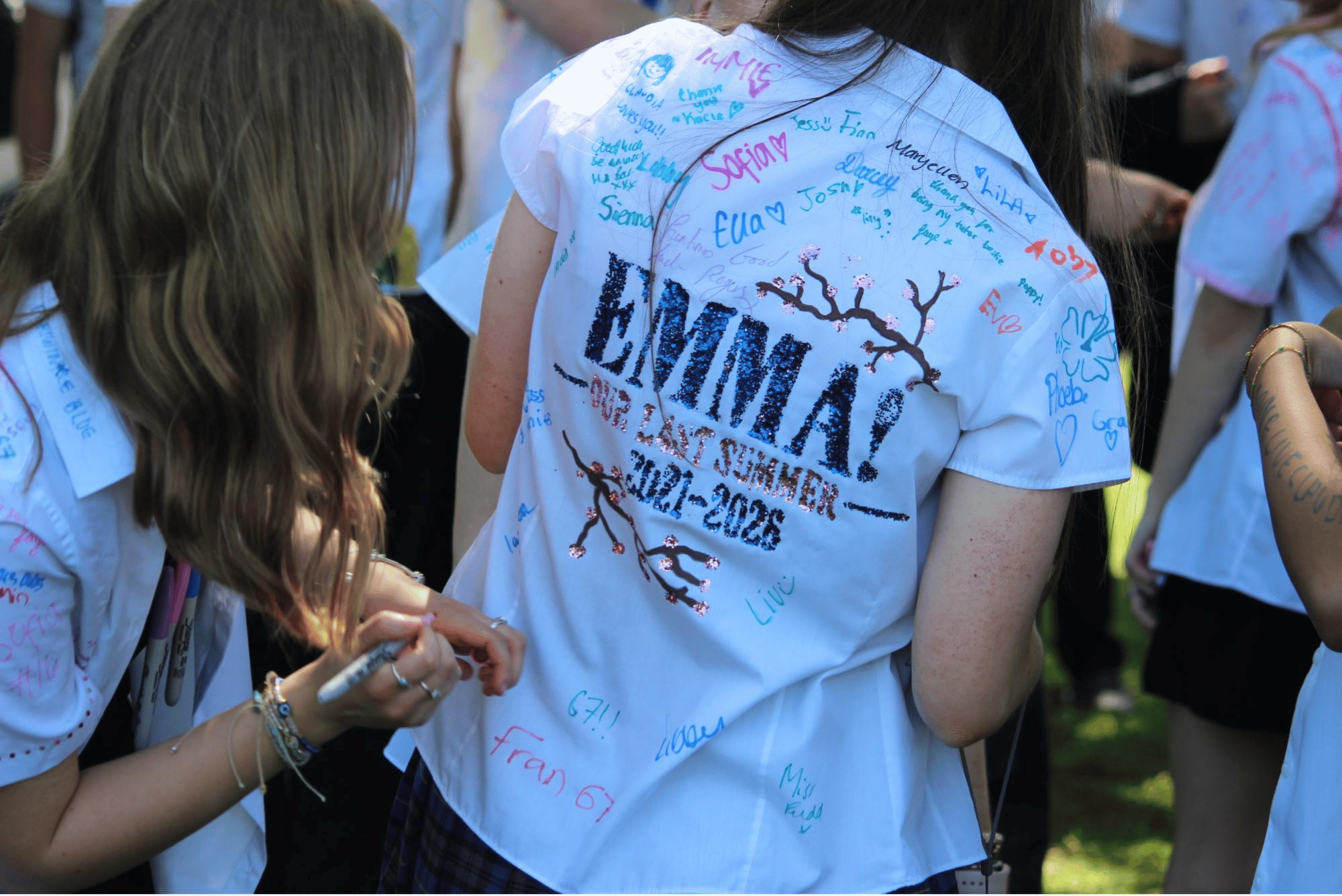 Year 11 pupil's shirt featuring a custom "Mamma Mia!" design surrounded by messages and signatures from friends.