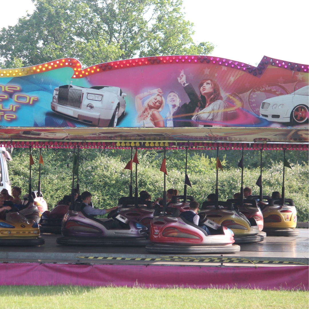 Pupils riding on a dodgems attraction at the prom fairground.