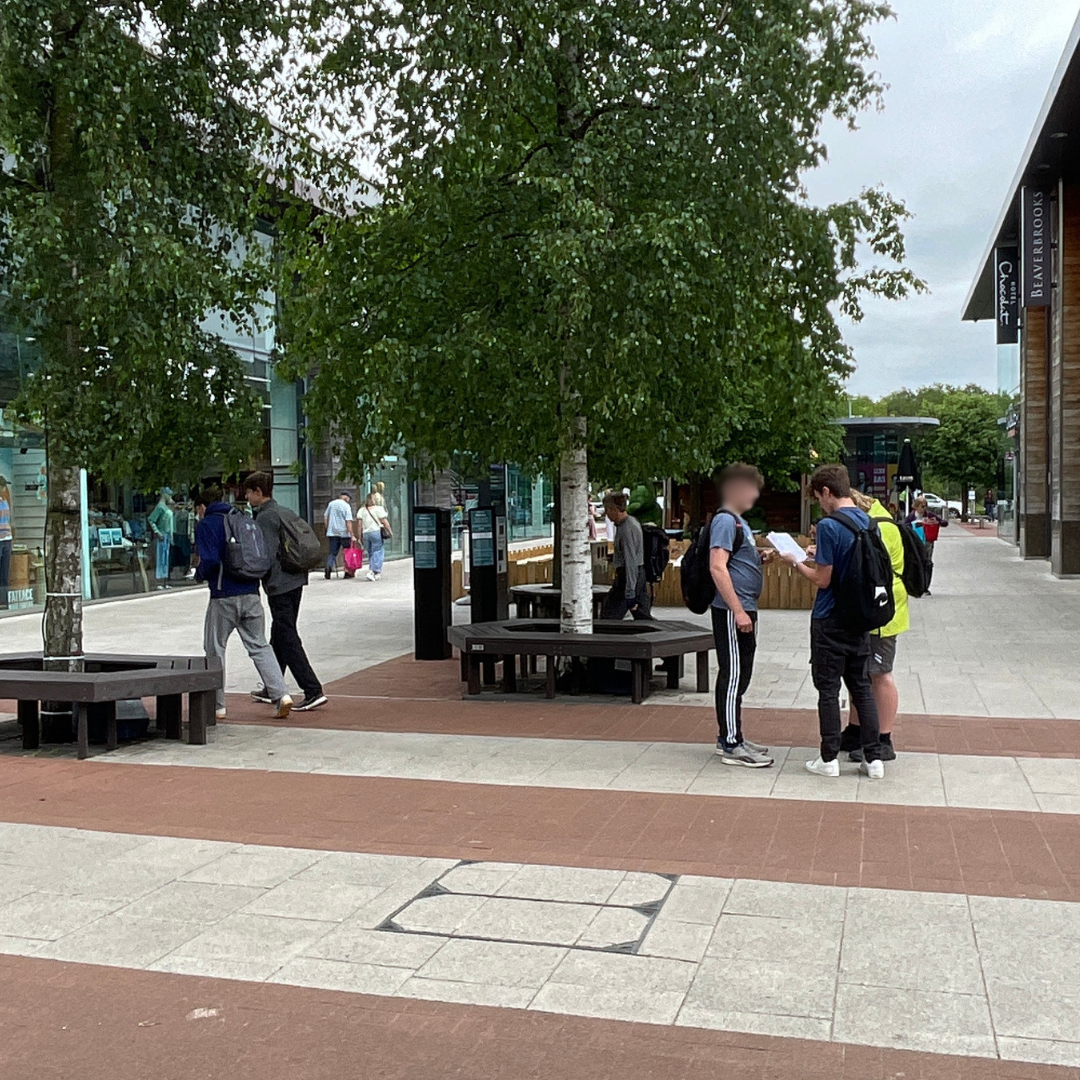 Pupils conduct geography fieldwork in Whiteley town centre, gathering data and observations.