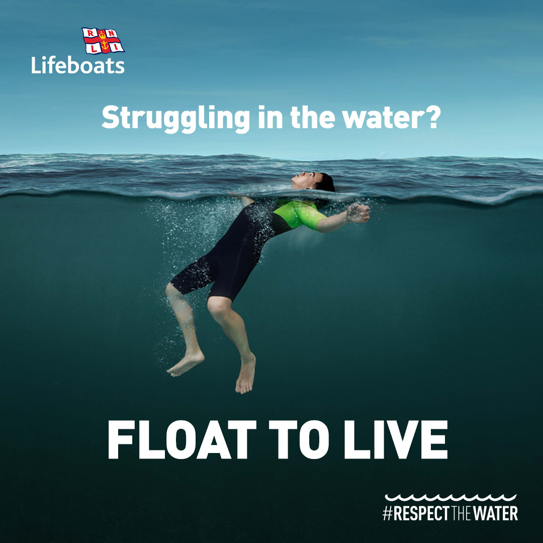 image shows an RNLI water safety campaign graphic featuring a person floating on their back in open water with the message: "Struggling in the water? Float to Live" and the hashtag "Respect the Water