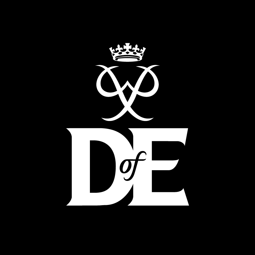 Black and white Duke of Edinburgh's Award logo on a black background. The design features a crowned royal cipher above large serif letters "D" and "E", with the word "of" positioned between them. The logo represents The Duke of Edinburgh's Award programme.