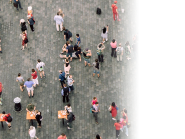 Image shows a pedestrian area from above with people walking, sitting and eating