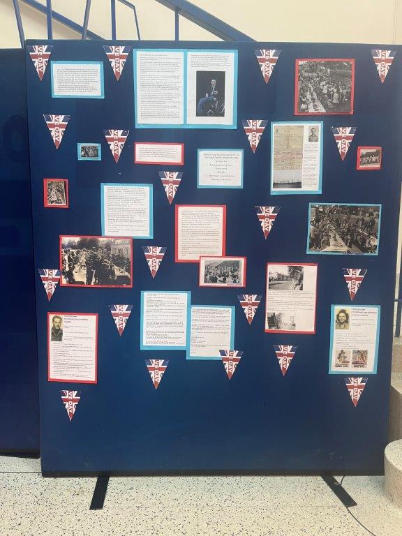 Image shows the display board that was in the S-block lobby showing stories and photos from VE Day, 80 years ago.