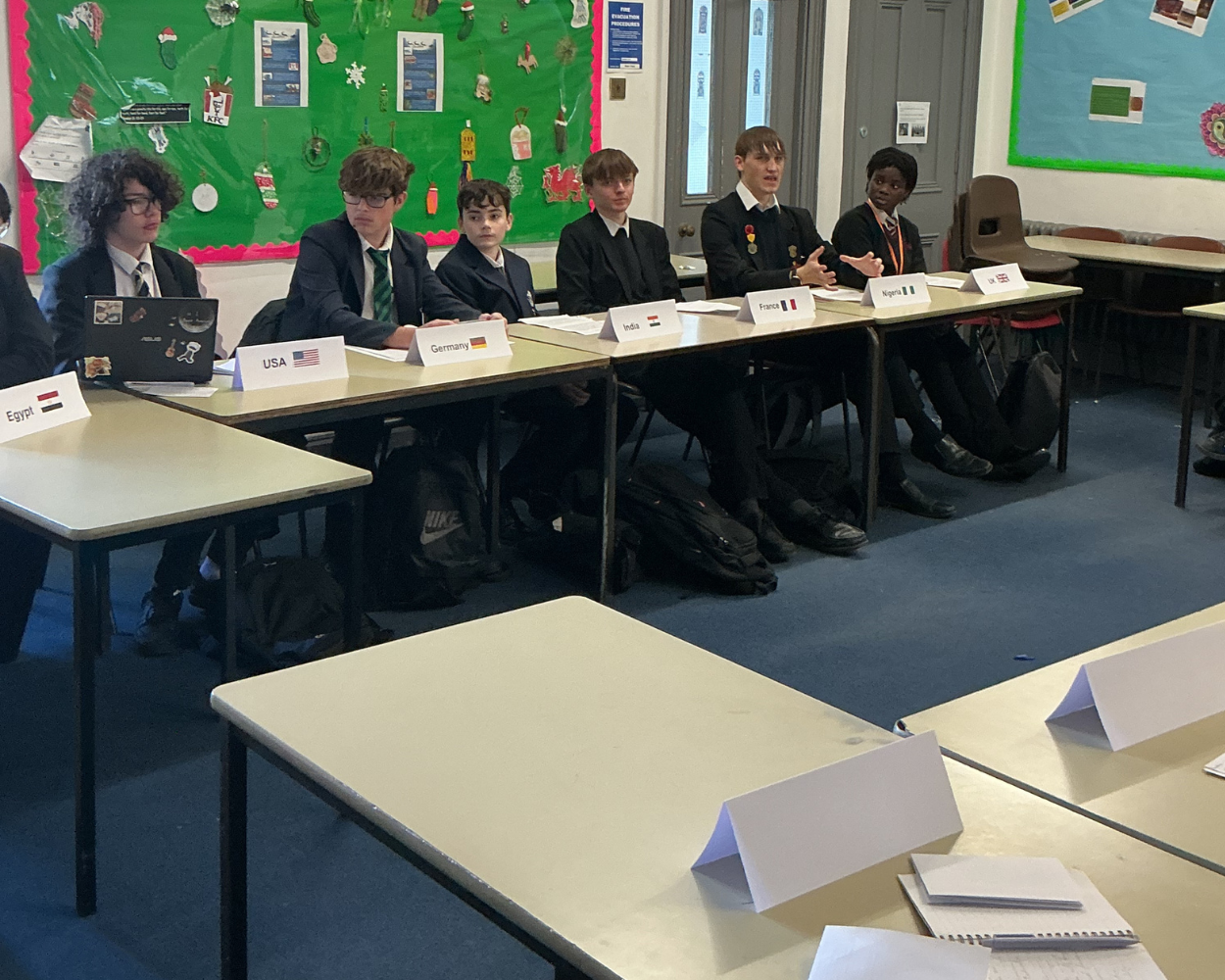 Image shows a different group of pupils discussing matters