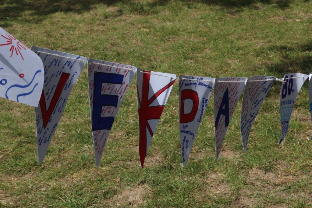 Image shows VE Day bunting that was used on the school field during the field party for Year 7s.