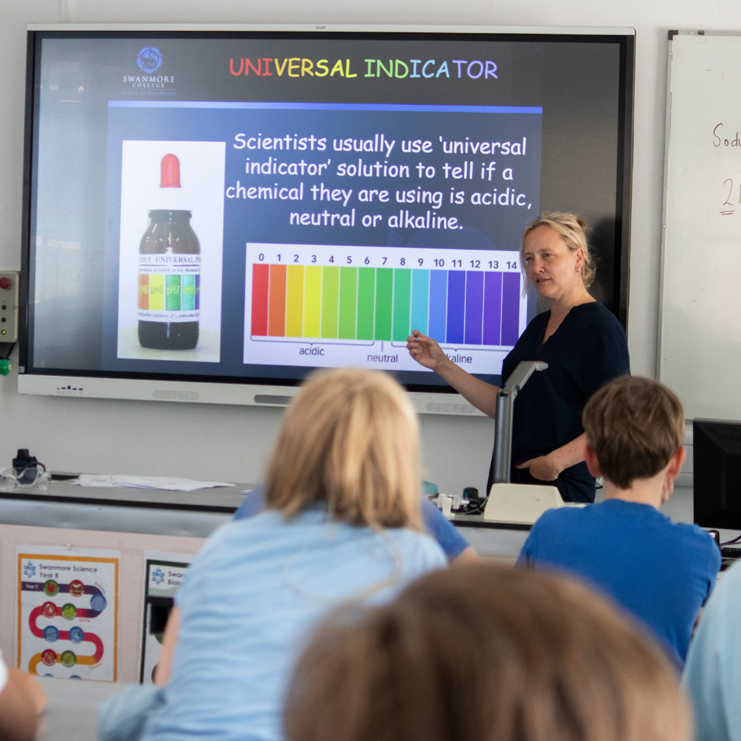 Image shows a Science lesson where pupils are learning about Universal indicator and pH levels