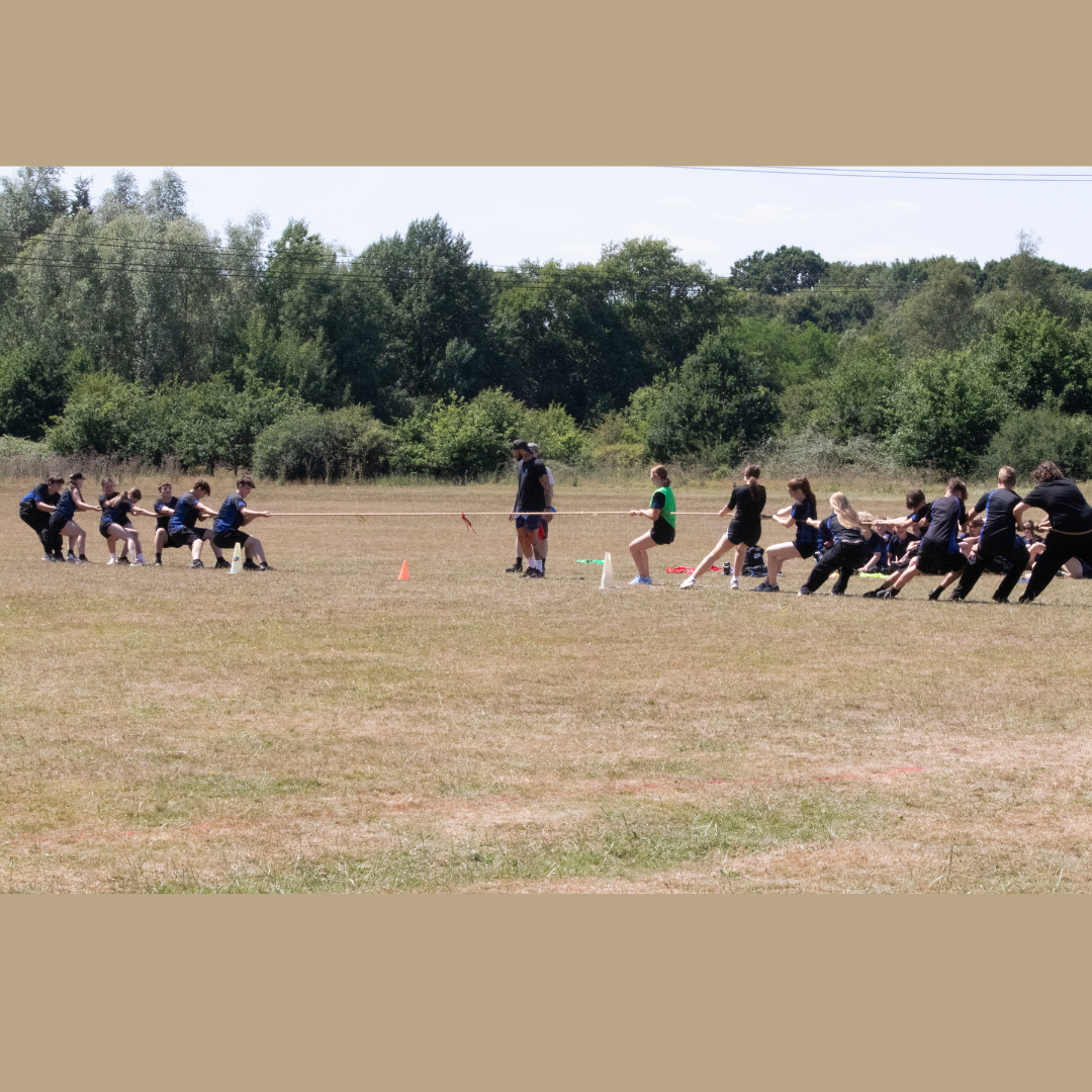 Image shows pupils taking part in tug of war