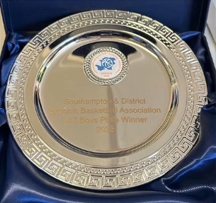 A silver Southampton & District Schools Basketball Association plate displayed in a blue satin presentation case. The engraving reads “U16 Boys Plate Winner 2026”.