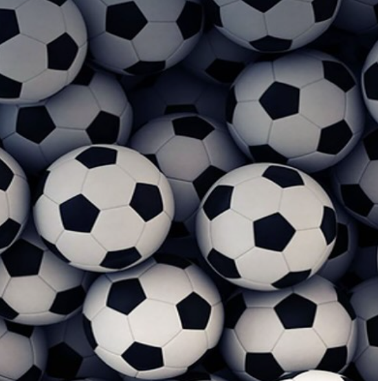 Image shows a pile of footballs taking up the entire picture