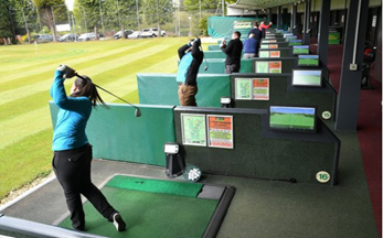 Image shows people using the driving range