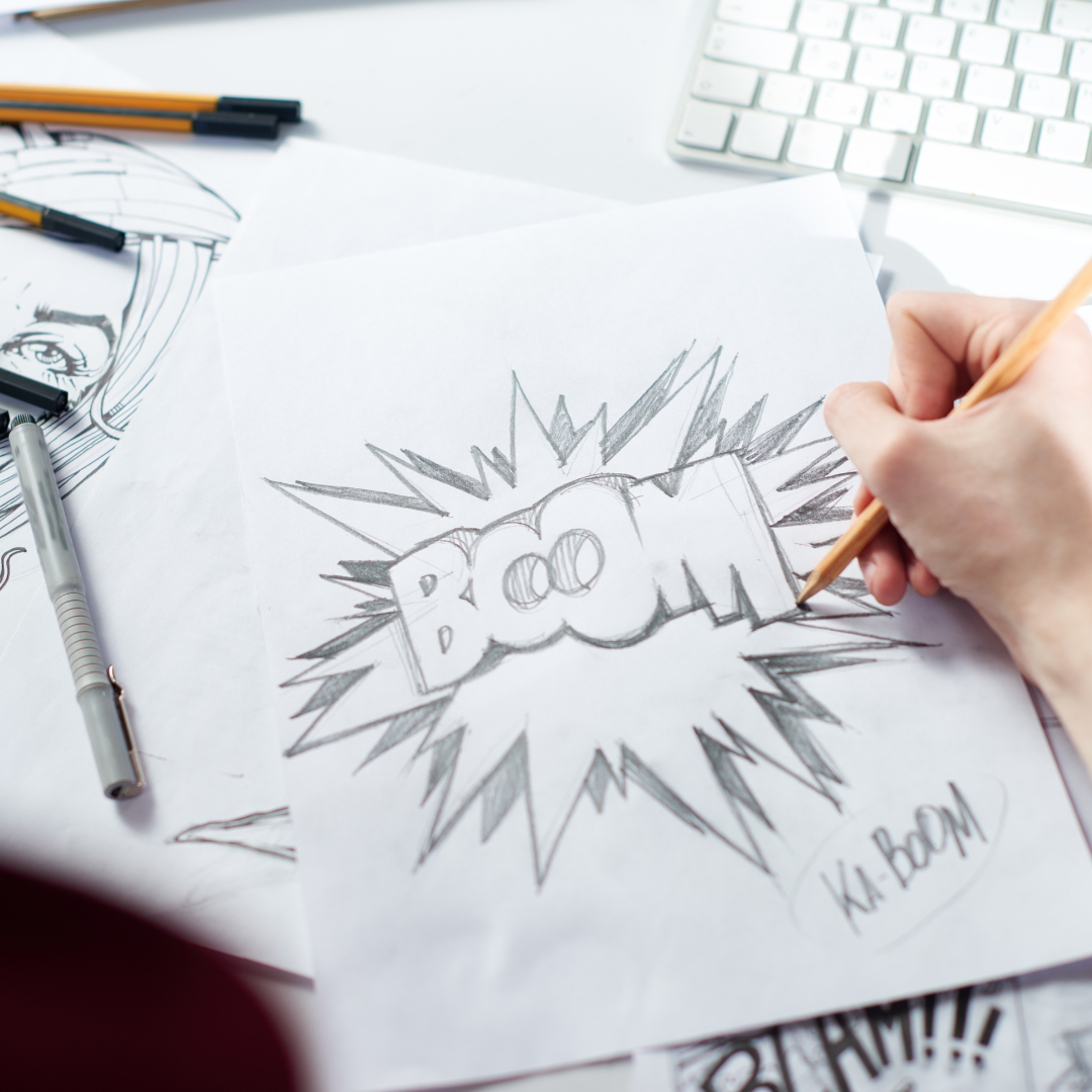 Image shows someone sketching the word boom in a comic book style