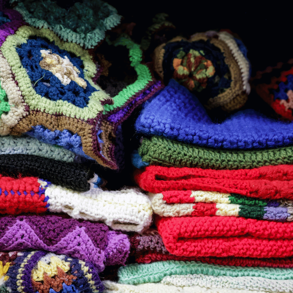 Image shows crochet blankets made up of different colours and different stitches