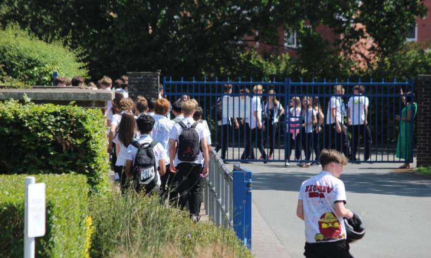 Year 11 pupils leave the College site in signed shirts at the end of their final day at Swanmore.