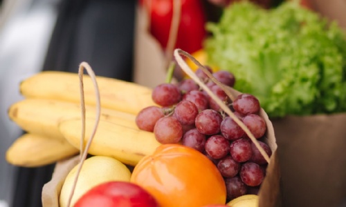 Image shows a variety of different fruit and vegetables.