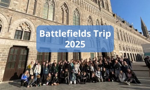 Image shows the year 8 group of pupils and teachers who went on the Battlefields trip in 2025, standing outside a church.